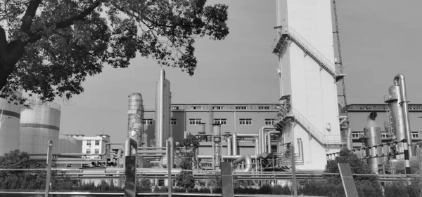 black and white image of a modern industrial factory