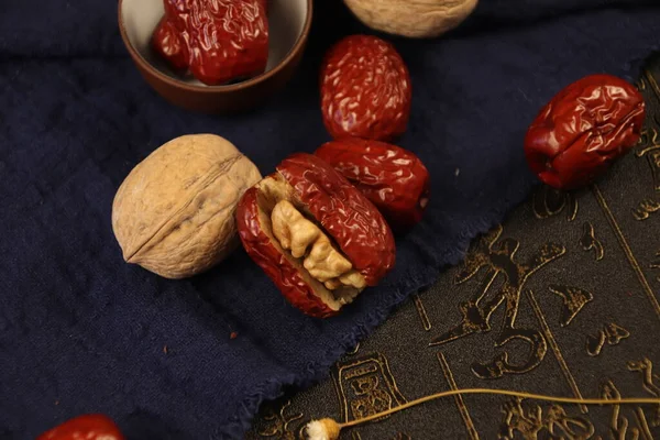 dried fruits and nuts on a black background