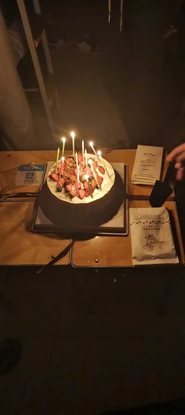 a closeup shot of a restaurant table with a candle and a burning candles