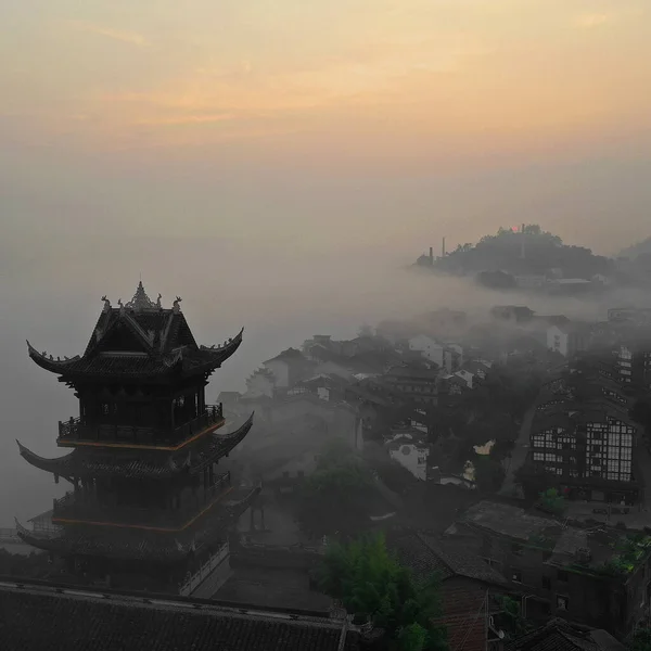 the forbidden city in the fog