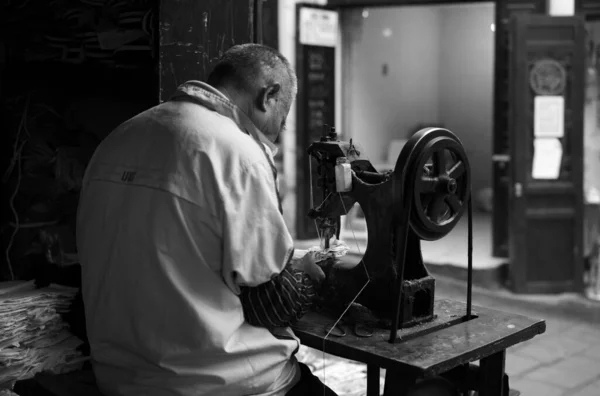 young man with tattoo and beard in the workshop