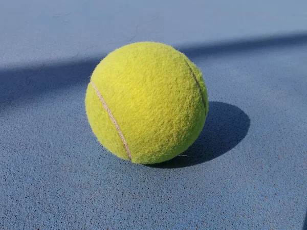 tennis ball on the ground