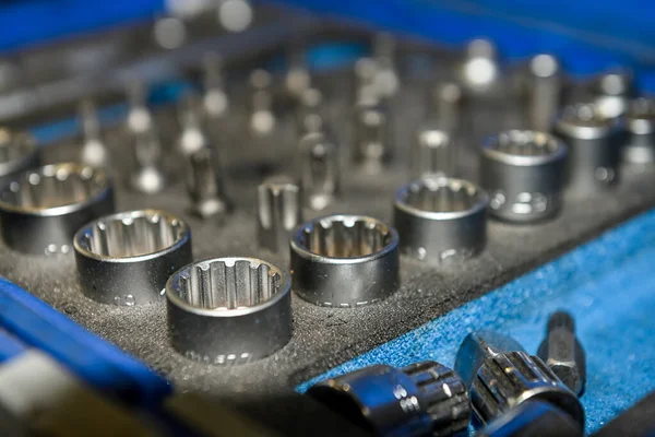 Set of socket wrenches, in a mechanical workshop.