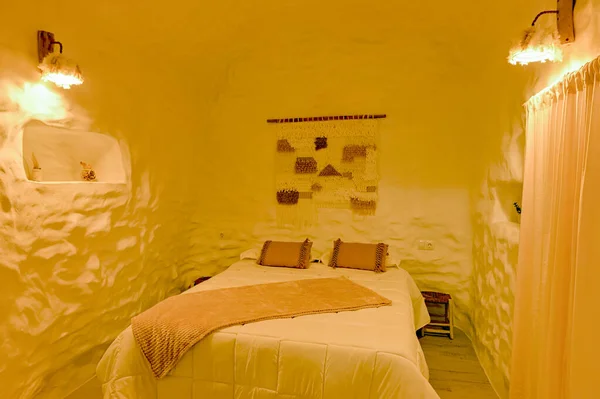 Bedroom inside a troglodyte cave for rural tourism.