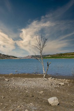 Reservoir with very low water level due to climate change and drought