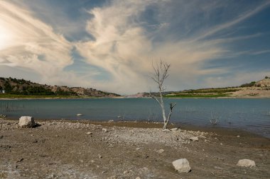 Reservoir with very low water level due to climate change and drought