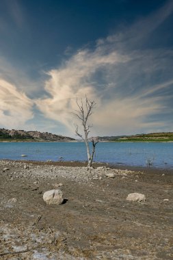 Reservoir with very low water level due to climate change and drought