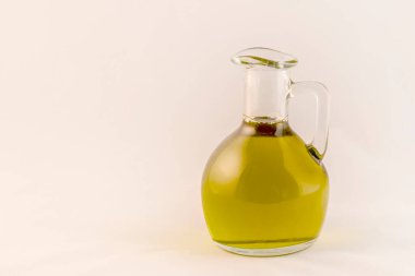 Small bottle of olive oil with a white background.