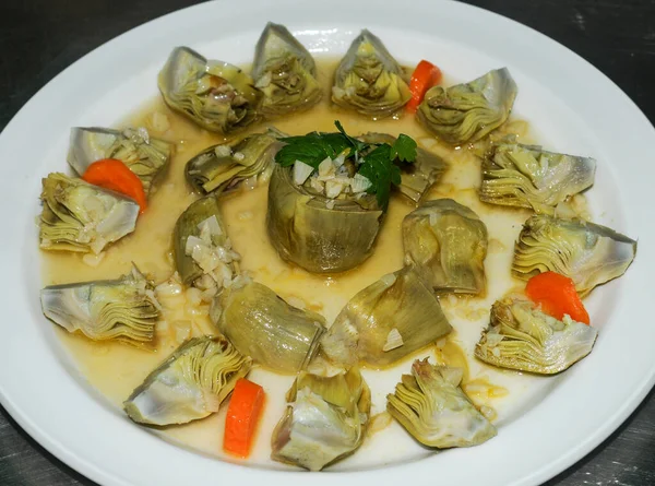 Artichoke hearts cooked with virgin olive oil