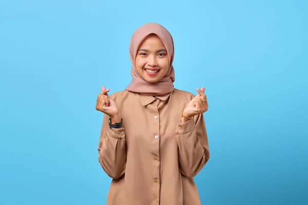 Portrait Smiling Young Asian Woman Showing Finger Hearts Blue Background — Stock Photo, Image