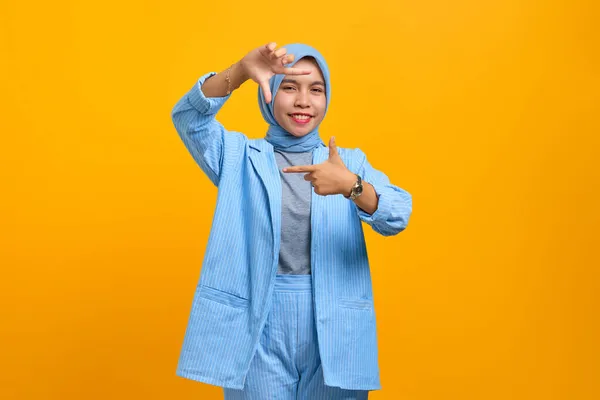 Cheerful Young Asian Woman Making Frame Hands Fingers Isolated Yellow — Stock Photo, Image