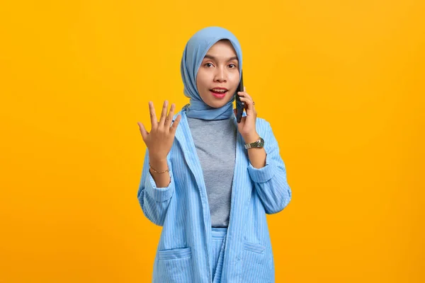 Surprised Young Asian Woman Talking Mobile Phone Raised Hands Isolated — Stock Photo, Image