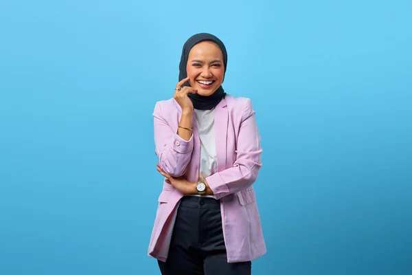 Portrait Cheerful Asian Woman While Touching Cheek Blue Background — Stok Foto