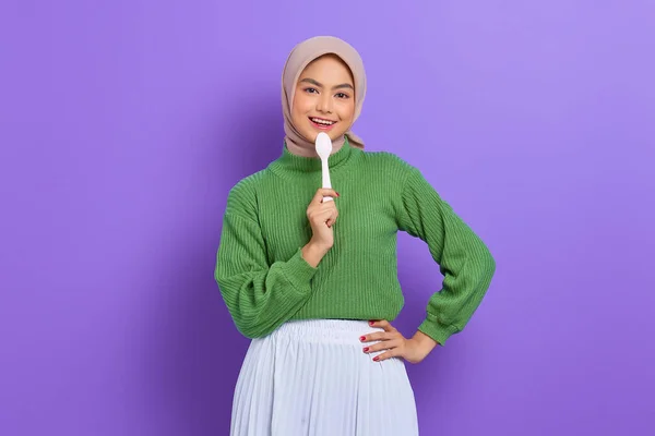 Beautiful Young Asian Woman Green Sweater Holding Spoon Her Mouth — Stock Photo, Image