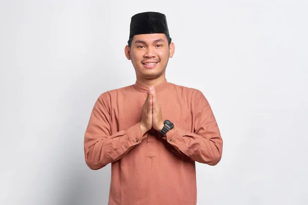 Smiling Young Asian Muslim Man Gesturing Eid Mubarak Greeting Isolated — Stock Photo, Image
