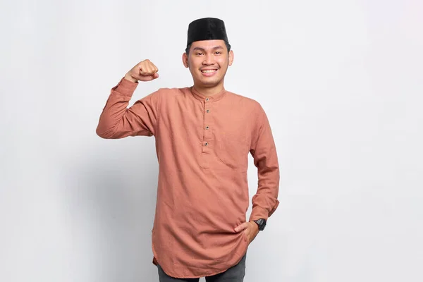 Smiling Asian Muslim Man Raises Arms Show Muscle Isolated White — Stok Foto