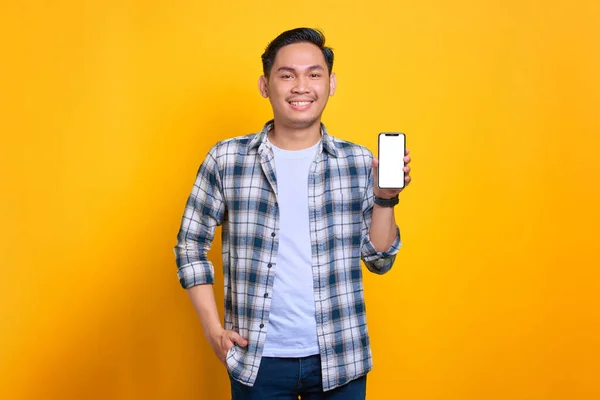 Smiling Young Asian Man Plaid Shirt Showing Mobile Phone Blank — 스톡 사진
