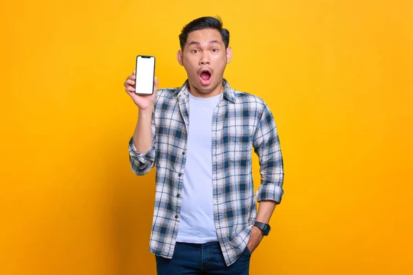 Shocked Young Asian Man Plaid Shirt Showing Mobile Phone Blank — 스톡 사진