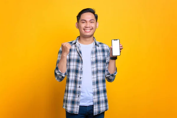 Excited Young Asian Man Plaid Shirt Holding Mobile Phone Blank — 스톡 사진