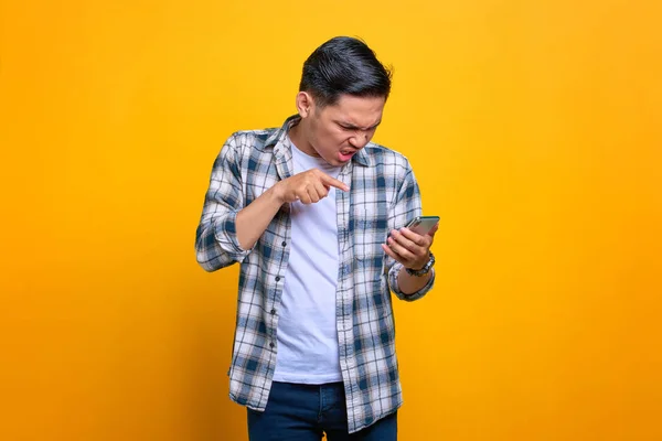 Angry Young Asian Man Plaid Shirt Using Mobile Phone Reacting — 스톡 사진