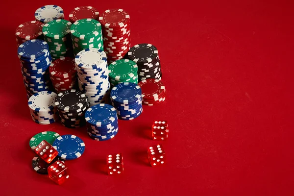 Poker chips on red background. Group of different poker chips. Casino background. — Stock Photo, Image