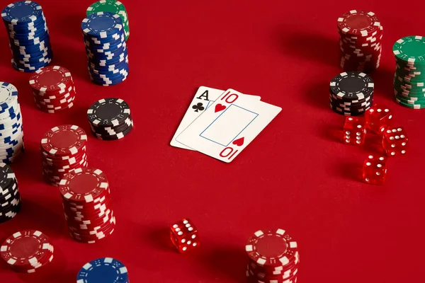 Two cards and chips on a red background. Big bet of game money. Cards - Ace and Ten. Your distribution at the table — Stock Photo, Image