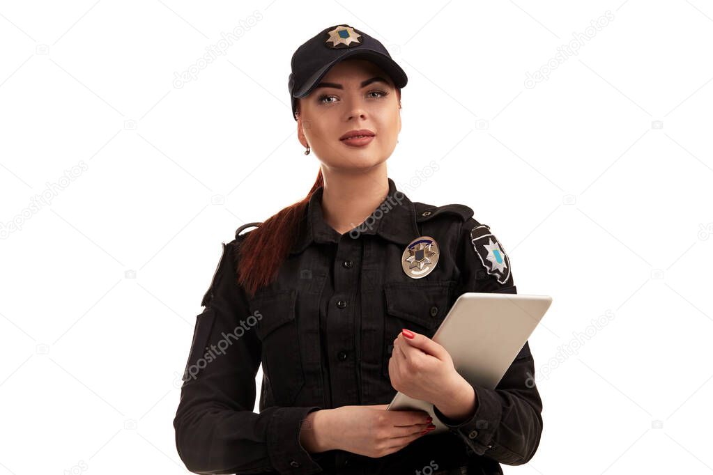 Close-up portrait of a female police officer is posing for the camera isolated on white background.