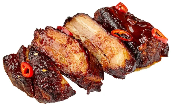 Slices of grilled pork ribs in barbecue sauce with chili peppers on white background — Stock Photo, Image