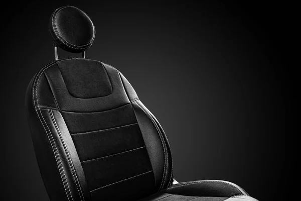 Comfortable front car seat back with round headrest on black background — Fotografia de Stock