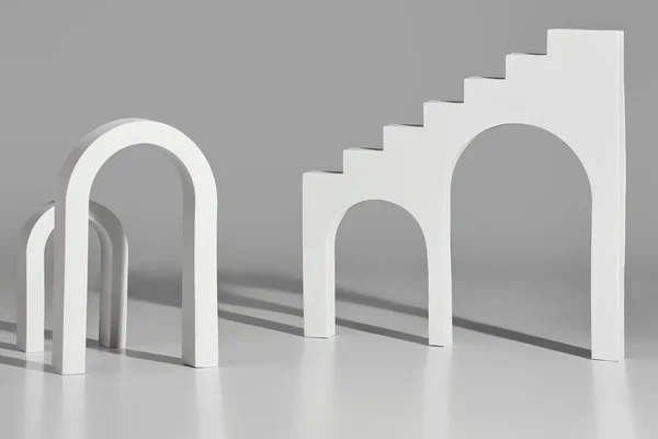 Белые арки и лестницы с арочными отверстиями на сером фоне — стоковое фото