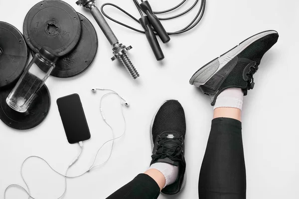 Womens Legs Sneakers Fitness Clothing Smartphone Dumbbells Headphones Top View — Stockfoto