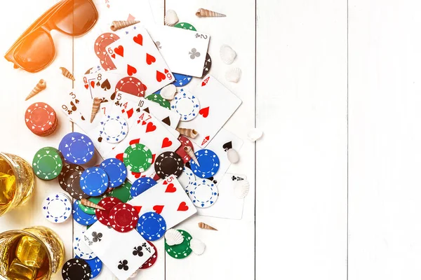 Gambling Poker Chips Cards Sunglasses Flip Flops White Wooden Table — Stock Photo, Image