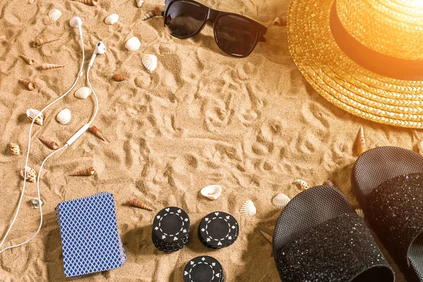 Beachpoker Chips Cards Sand Seashells Sunglasses Flip Flops Top View — Zdjęcie stockowe