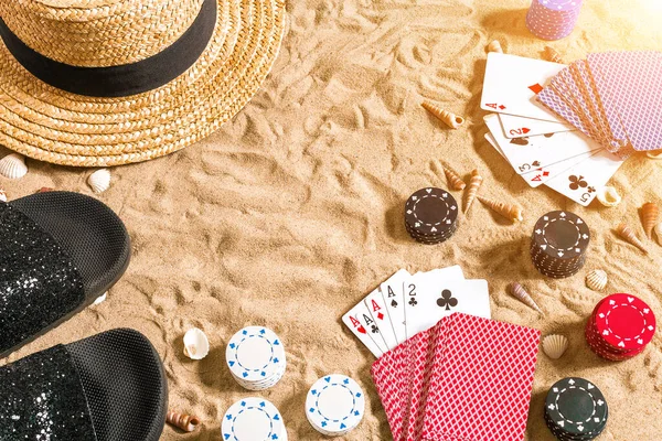 Beachpoker Chips Cards Sand Seashells Hat Flip Flops Top View — Stock Photo, Image