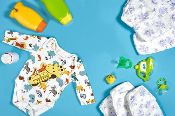 Baby Care Bath Set Nipple Toy Clothes Shampoo Blue Background — Fotografia de Stock