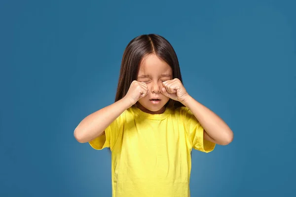 Sad Offended Little Girl Yellow Shirt Cries Blue Background — ストック写真