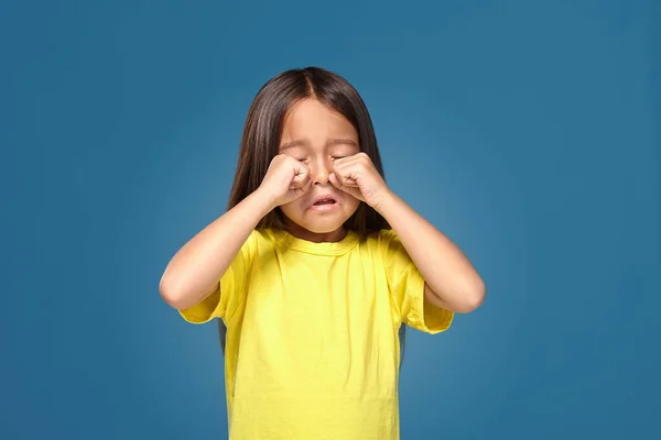 Sad Offended Little Girl Yellow Shirt Cries Blue Background — ストック写真