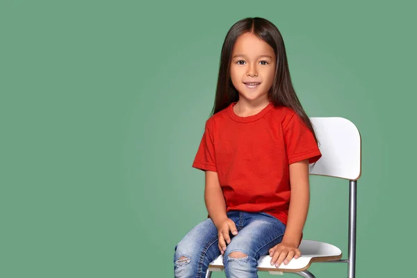 Little Girl Wearing Red Short Posing Chair Green Background — ストック写真