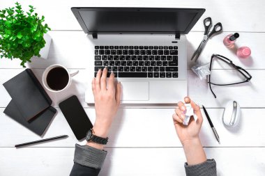 Overhead view of businesswoman working at computer in office. Place for your text. Ideal for blog. flat lay on white background