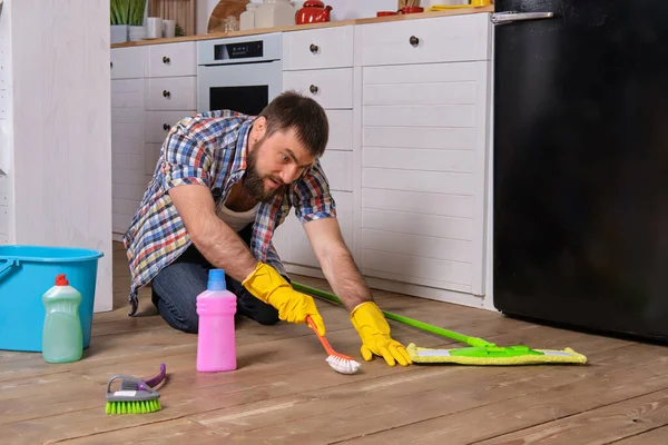 Housecleaning Concept Caucasian Handsome Young Bearded Man Checkered Shirt Sits — Stock Photo, Image