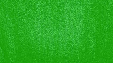 Arkaplan veya diğer tasarım illüstrasyonları ve sanat eserleri için pürüzlü yamaları olan yeşil soyut doku.