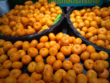 Beautiful yellow oranges. Fruits are high in vitamins, helping to maintain healthy eyesight.