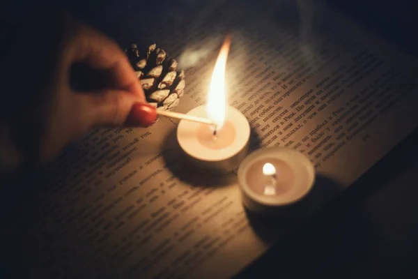 Girl Lights Candle Match She Has Red Manicure Candle Lies — Stockfoto