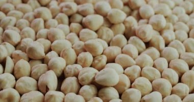 The background of the cleaned hazelnuts is a healthy and delicious ingredient in confectionery products and pastries