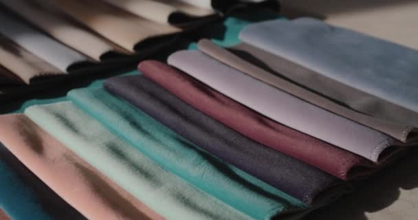 Dolly shot: Set of fabric samples - a palette for selecting a material for furniture, sewing clothes and other — 图库视频影像