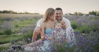 Portrait of a young family on a lavender field