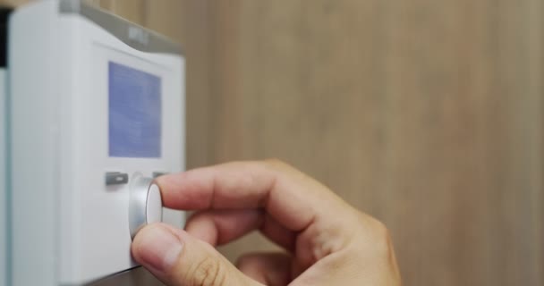 Homeowner Regulates Temperature House Electronic Control Panel — Video
