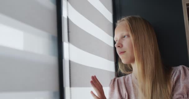 Teenage Girl Sitting Windowsill Looking Out Window — Stockvideo