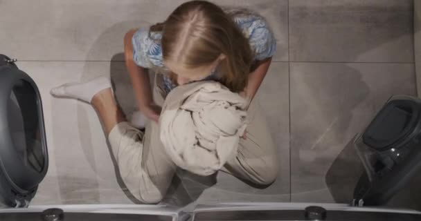 Teenage Girl Transfers Clean Clothes Washing Machine Dryer — Vídeos de Stock