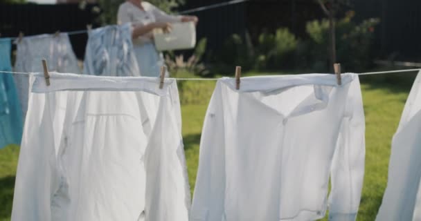 Middle Aged Woman Hanging Laundry Clothesline Dry — Vídeo de stock